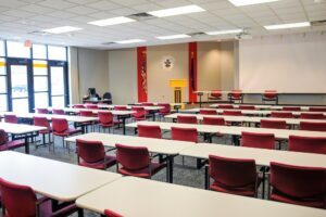 large classroom with tables and chairs