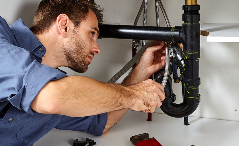 Plumber under sink