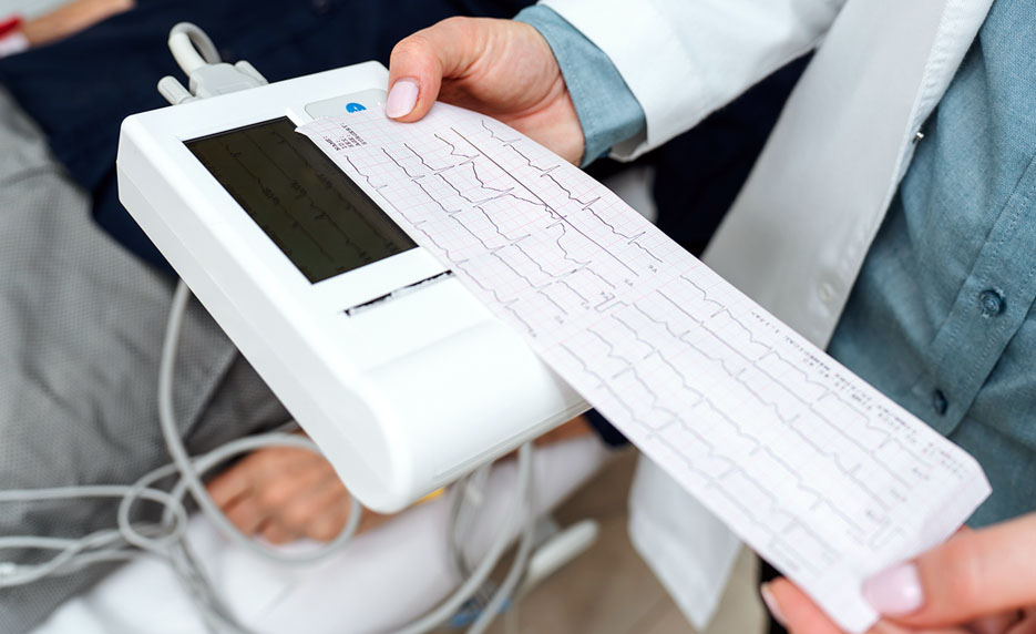 Person reading an EKG readout