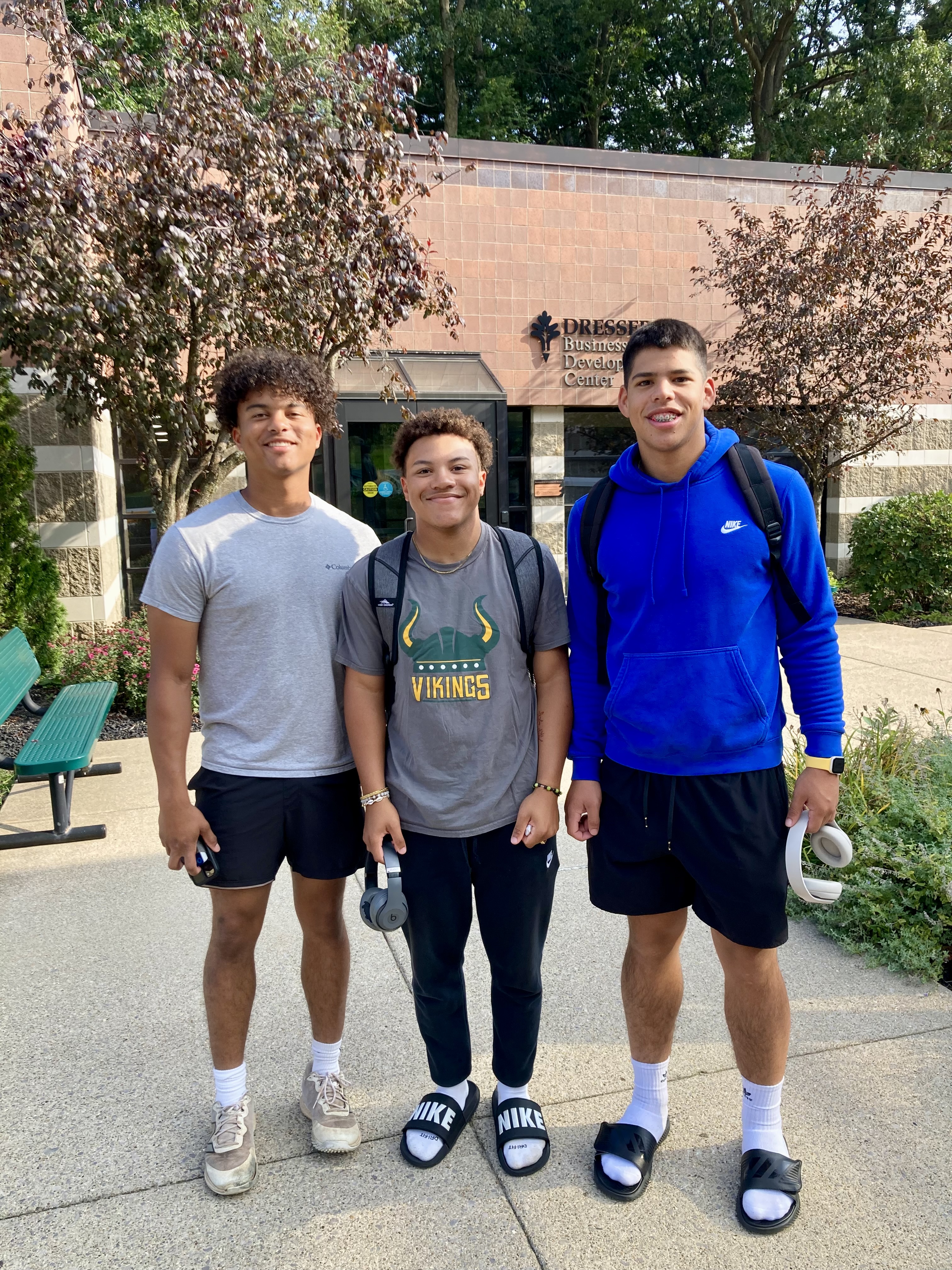 male students standing outside Glen Oaks main campus