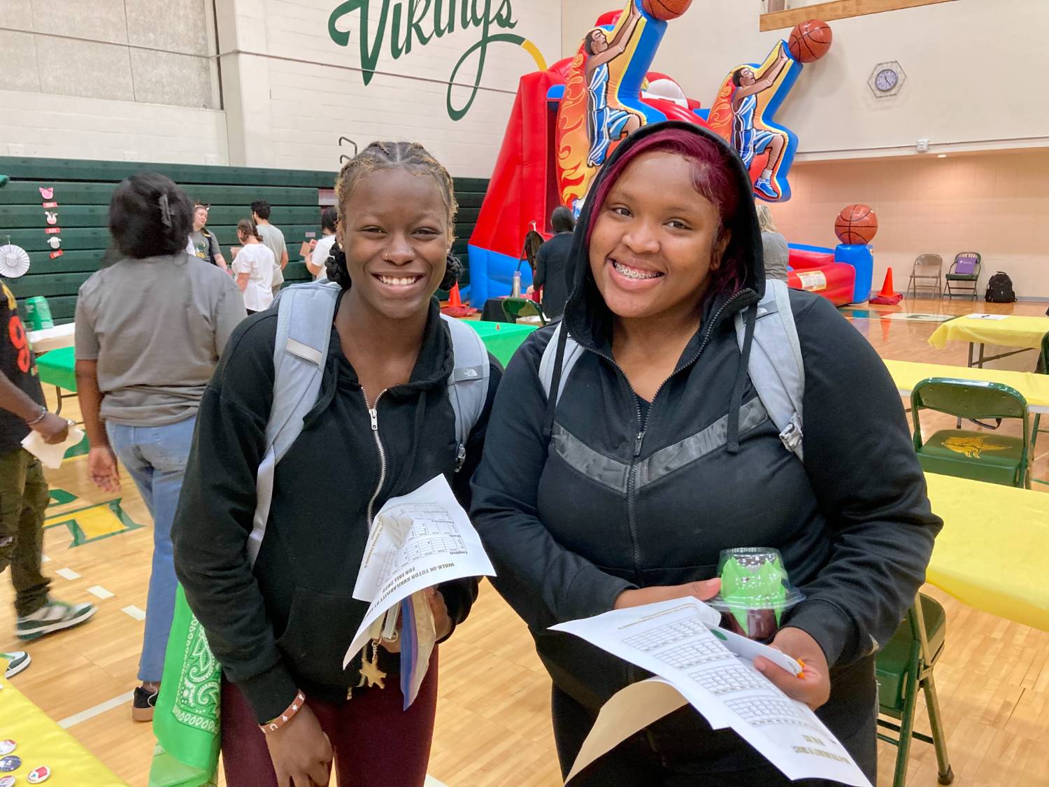 two women in green tops